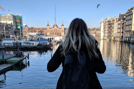 Student overlooking canal