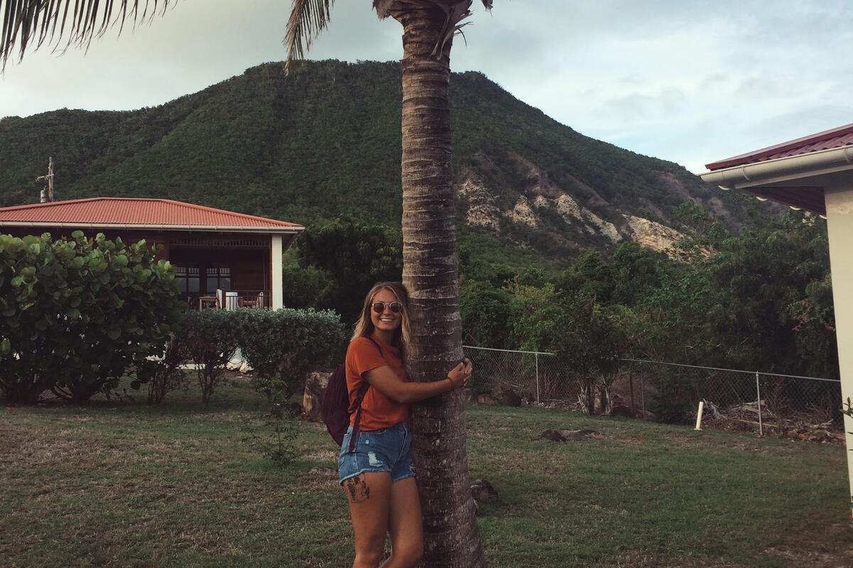 Student hugging tree Student hugging tree